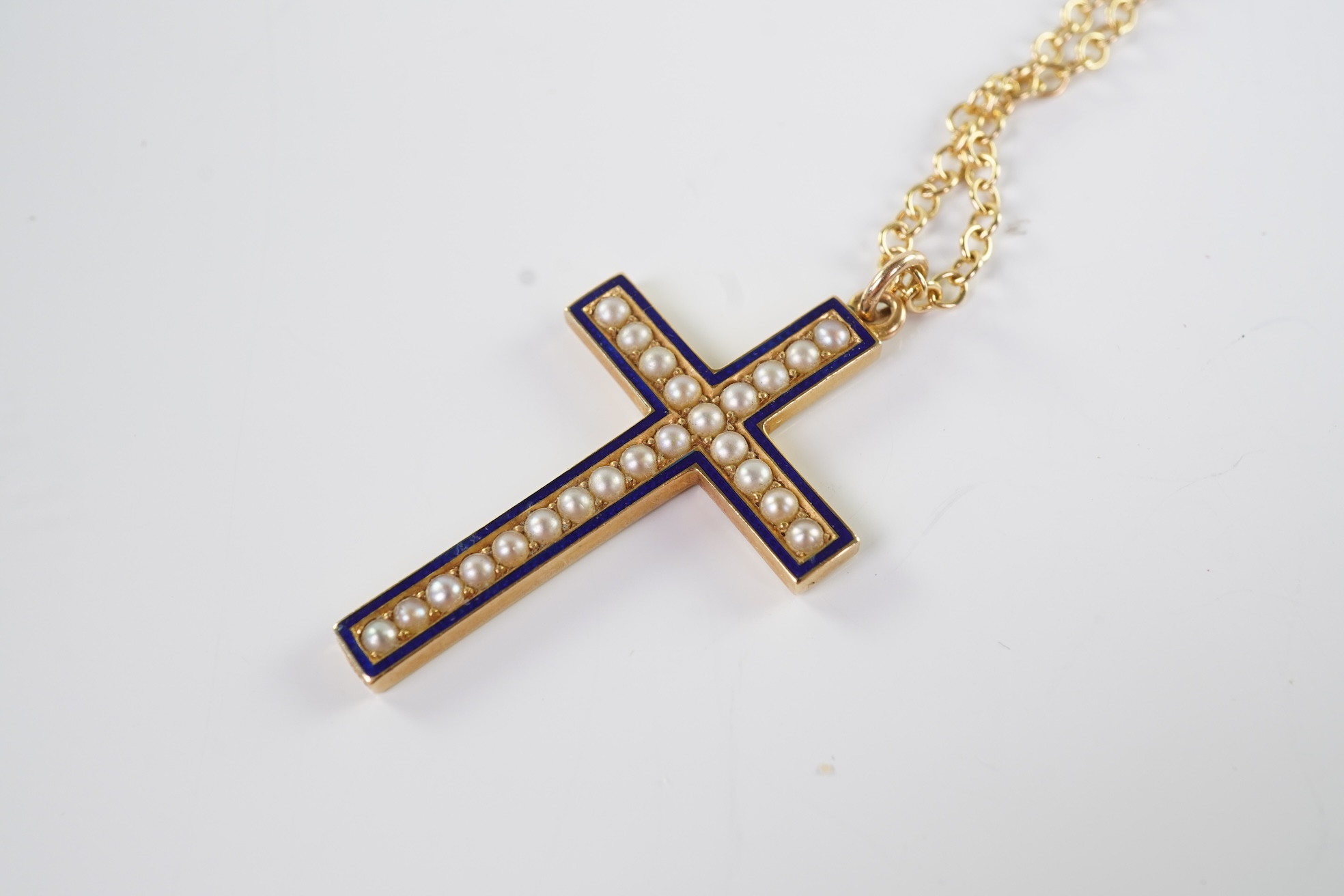 An Edwardian pearl and enamel cross and chain, early 20th century